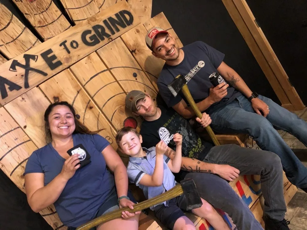 Axe to Grind Axe Throwing & Social House logo